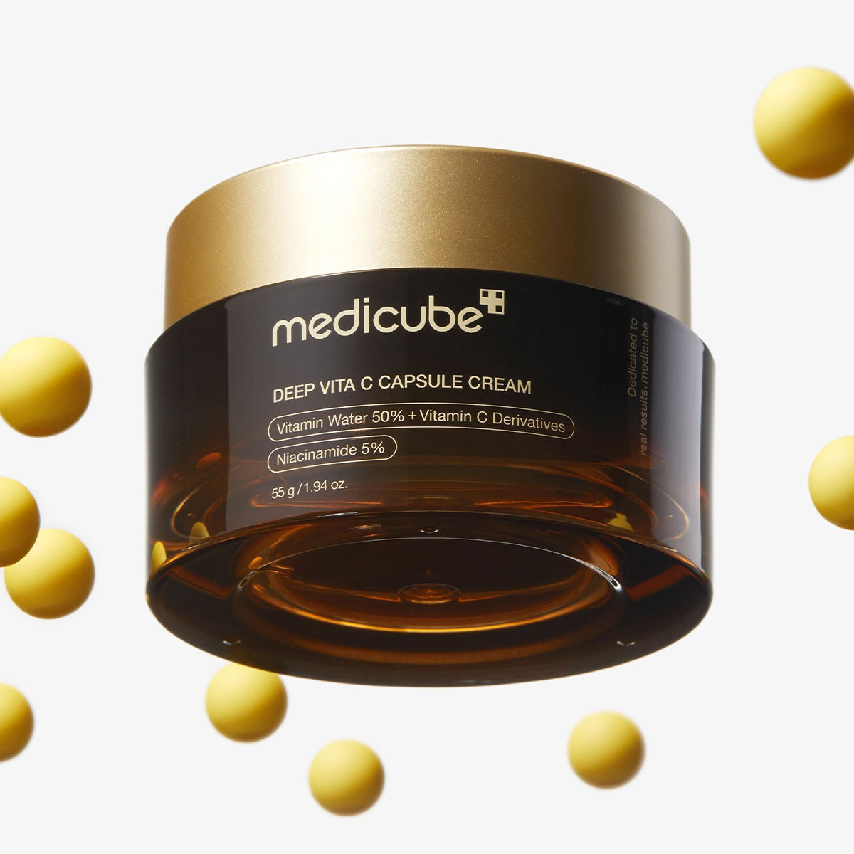 Medicube Deep Vita C Capsule Cream jar with capsules on a light gray background